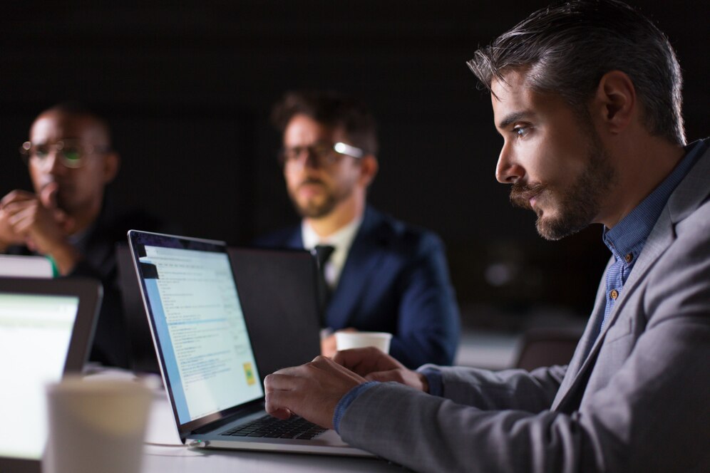 focused-bearded-office-employee-looking-laptop_74855-4203.jpg